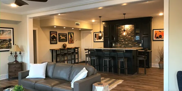 A living room with a couch and bar in it